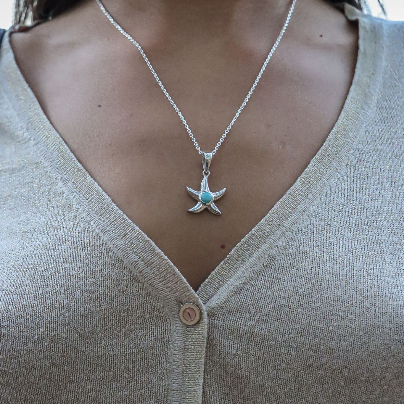 Model wearing sterling silver boho chic Dara pendant featuring Larimar gemstone