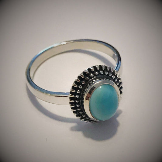 Sterling silver solitaire ring featuring a Larimar gemstone