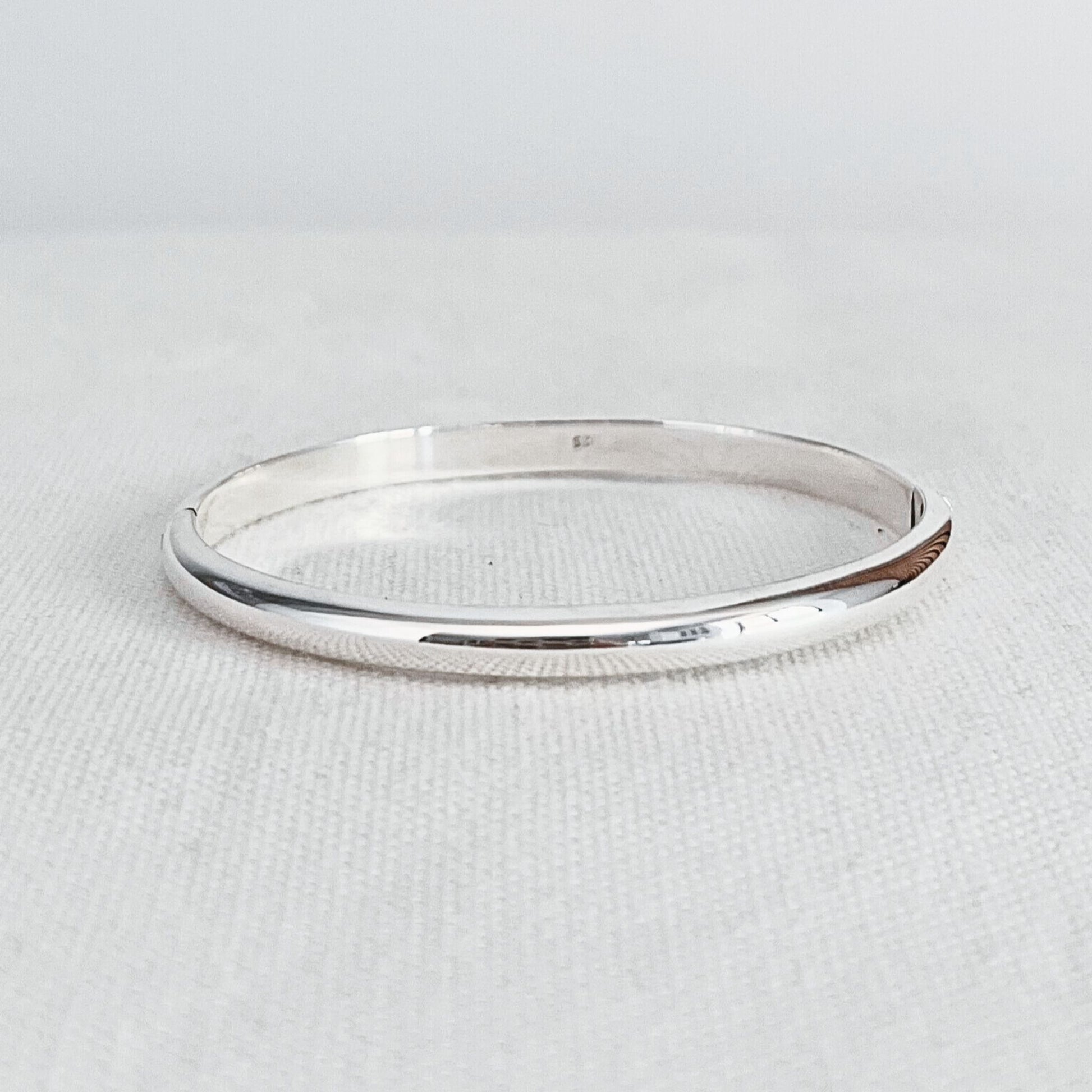 Half round profile hinged bangle beautifully crafted from genuine sterling silver