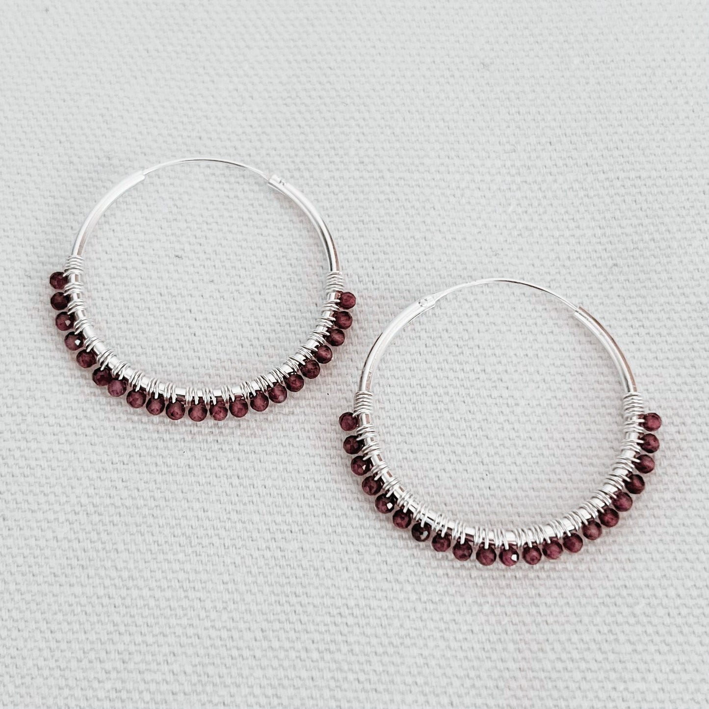 Bohemian boho chic Indriya hoops made of sterling silver and garnet gemstones