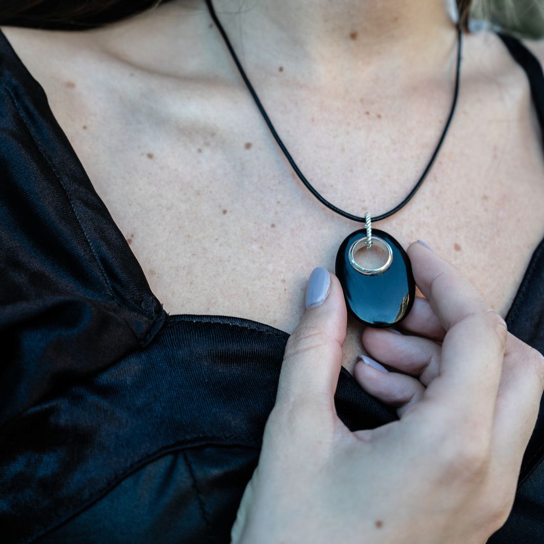 Model wearing black onyx gemstone bohemian boho chic Glohm pendant set in sterling silver