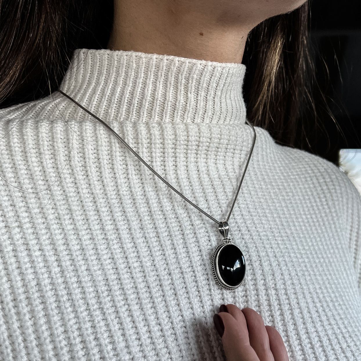 Model wearing black agate bohemian boho chic pendant made from the natural gemstone and sterling silver